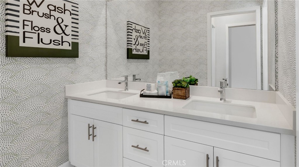 2016 Dewdrop Upland, CA 91786 - Photo 10 of 16 a bathroom with a sink and a mirror