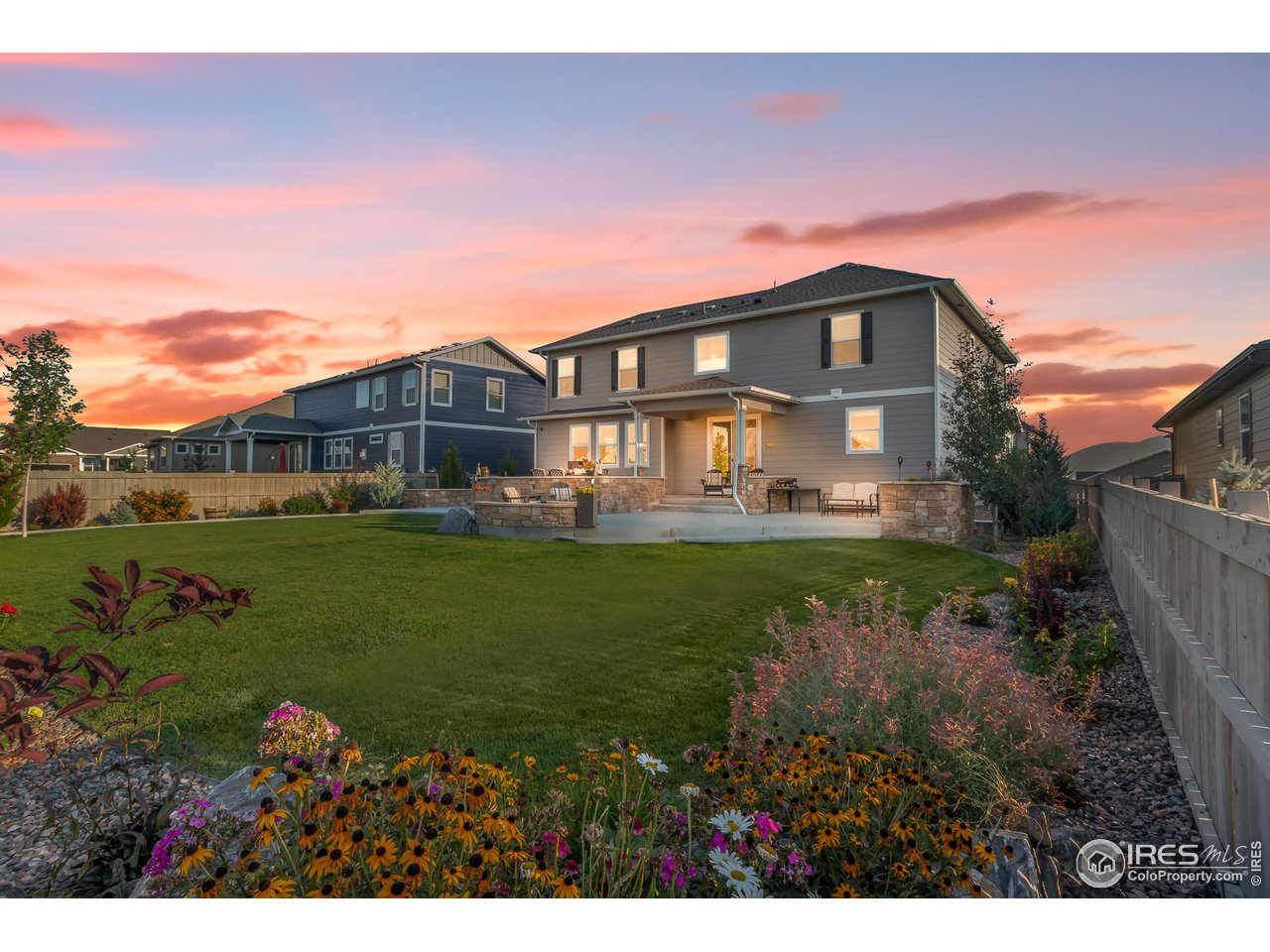 1687 Rivergate Way Berthoud, CO 80513 - Photo 13 of 39 a front view of a house with garden
