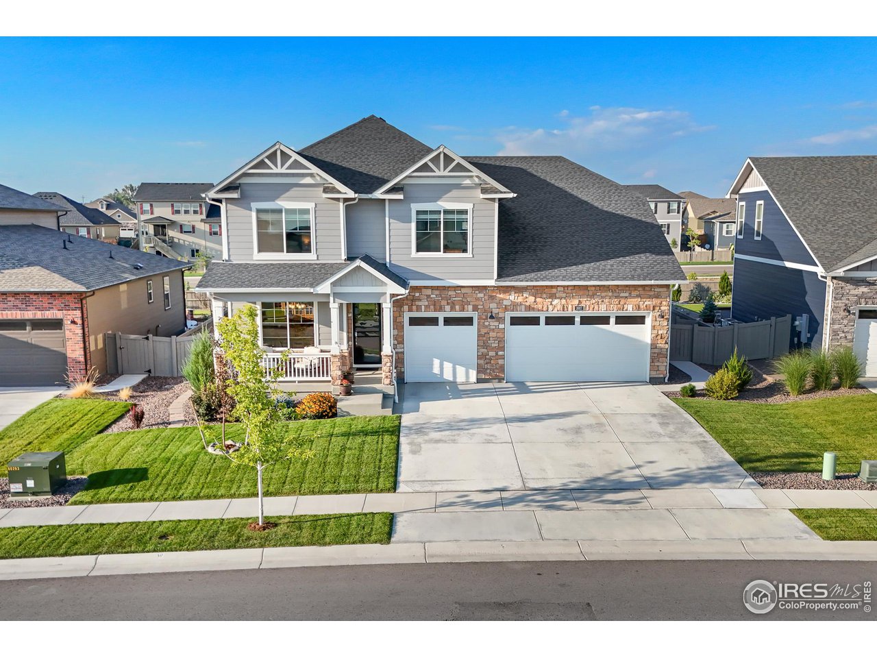 1687 Rivergate Way Berthoud, CO 80513 - Photo 14 of 39 a front view of a house with a yard