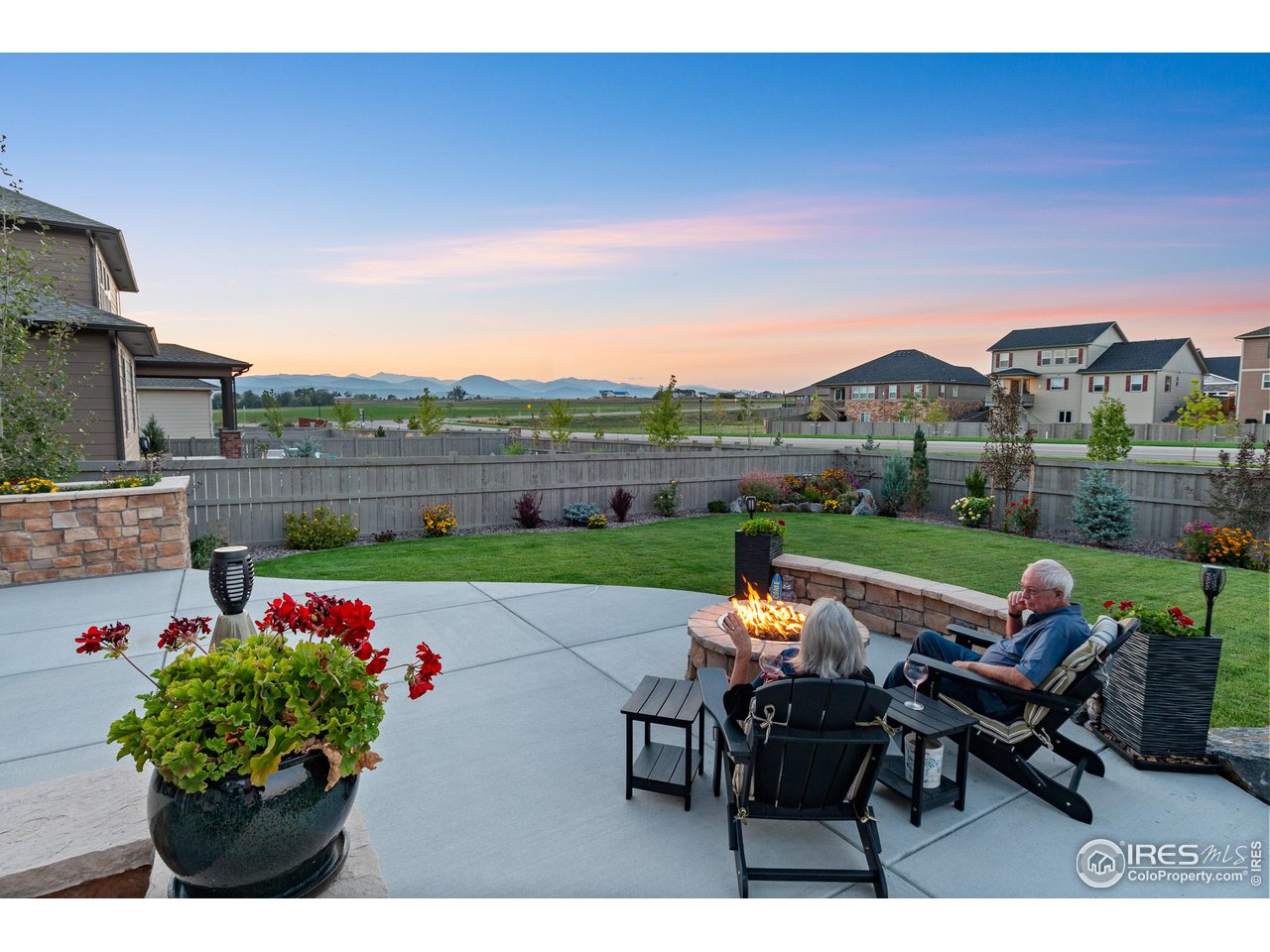 1687 Rivergate Way Berthoud, CO 80513 - Photo 15 of 39 a backyard of a house with outdoor seating