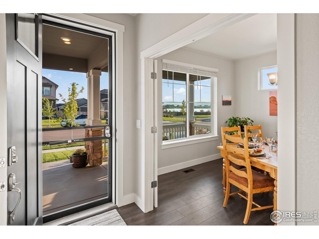 1687 Rivergate Way Berthoud, CO 80513 - Photo 19 of 39 a dining room with furniture and a window