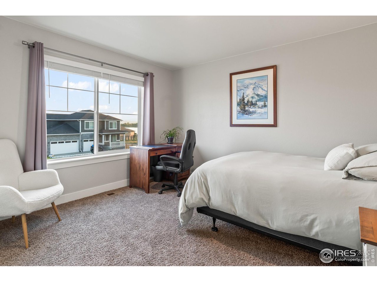 1687 Rivergate Way Berthoud, CO 80513 - Photo 34 of 39 a bedroom with a bed and a large window