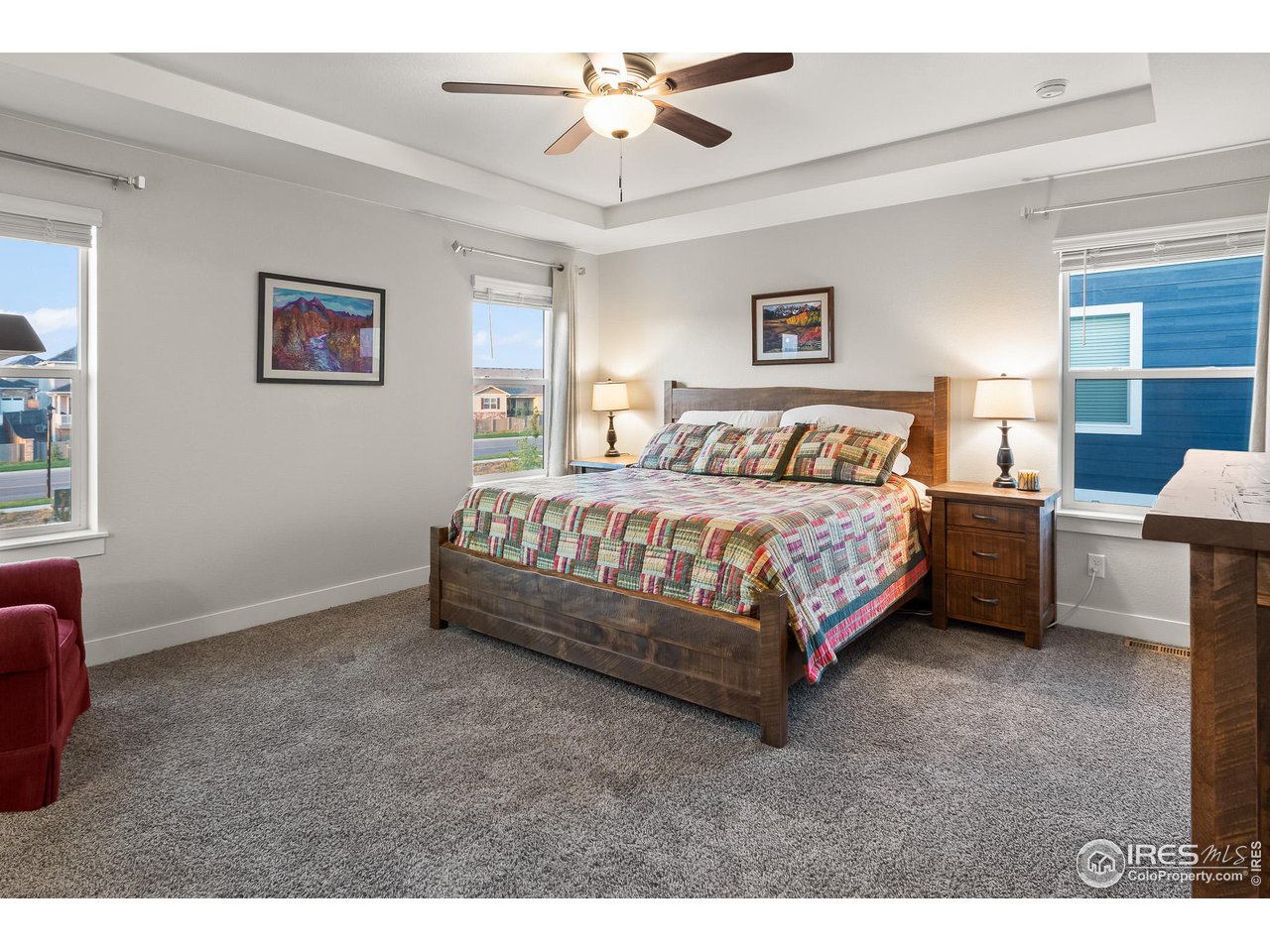 1687 Rivergate Way Berthoud, CO 80513 - Photo 36 of 39 a bedroom with a bed dresser and a window