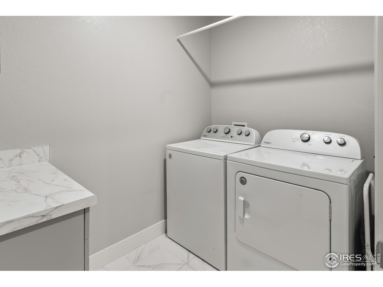 1687 Rivergate Way Berthoud, CO 80513 - Photo 37 of 39 a utility room with dryer and washer