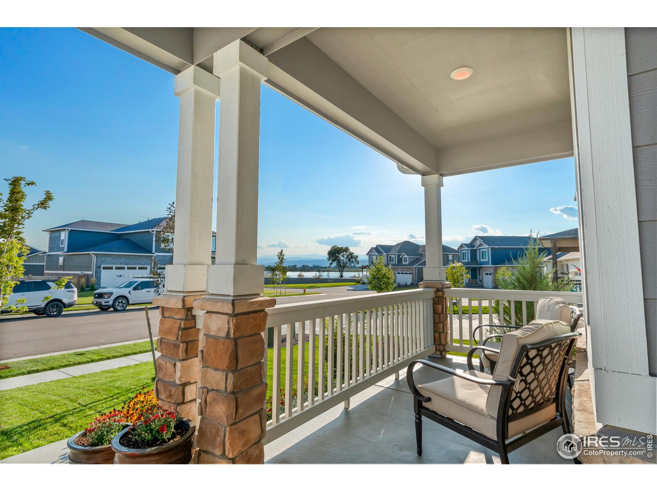 1687 Rivergate Way Berthoud, CO 80513 - Photo 5 of 39 a balcony with furniture and city view