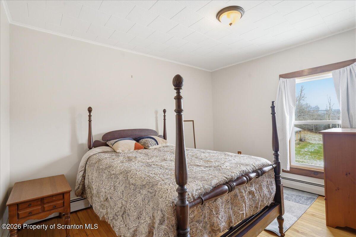 795 Wescott Road New Milford, PA 18834 - Photo 54 of 81 a bedroom with a bed and a window