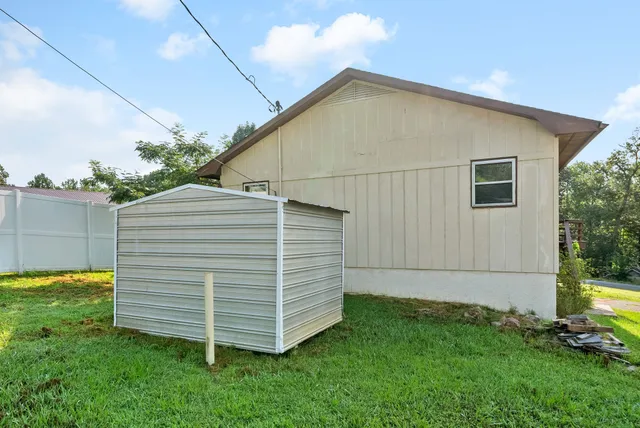 a view of a back yard of the house