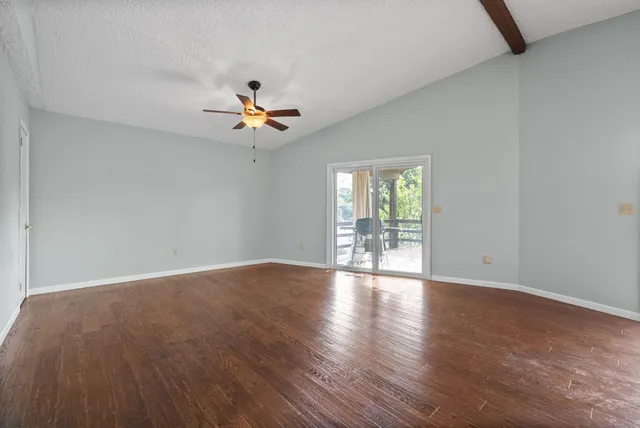 a view of an empty room with a window