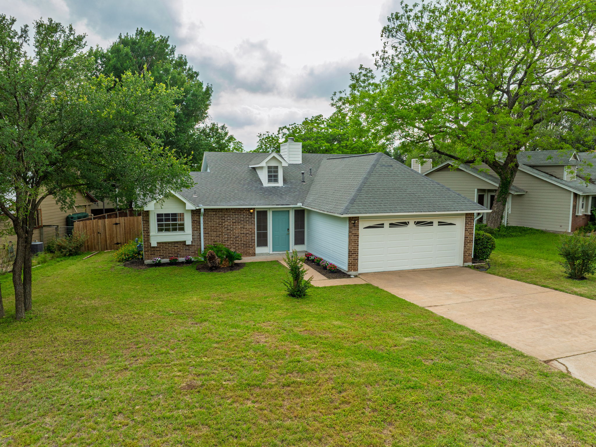 4815 Transit Circle Austin, TX 78727 - Photo 3 of 35 Slightly elevated view of the front exterior, showcasing the home’s charming curb appeal.