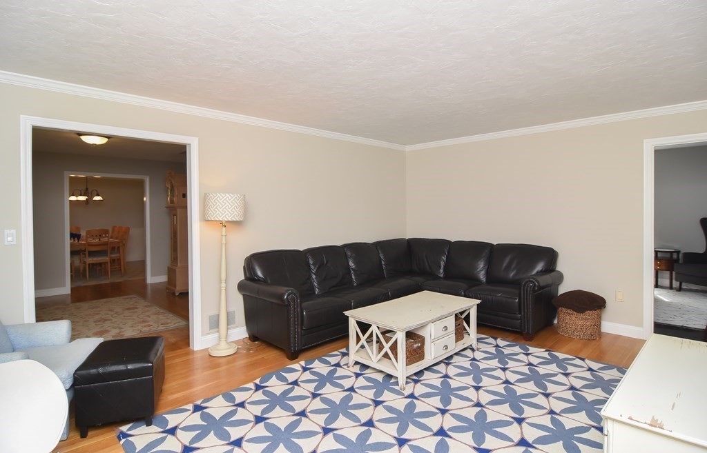 151 School Street Acton, MA 01720 - Photo 13 of 39 a living room with furniture and a couch