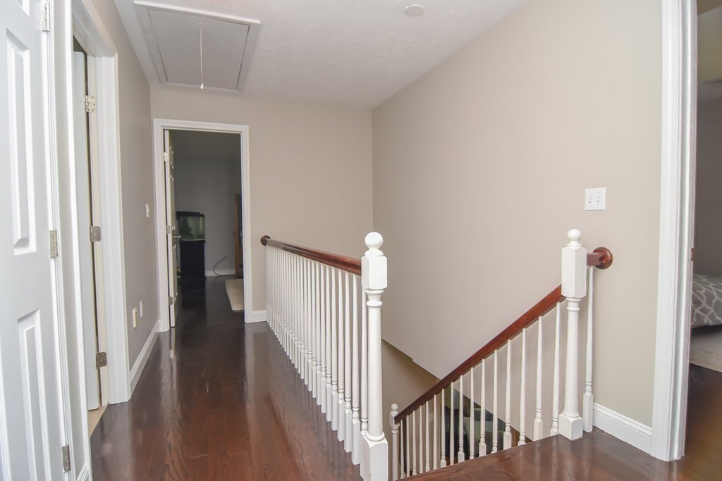 151 School Street Acton, MA 01720 - Photo 15 of 39 a view of a hallway with wooden floor and entryway