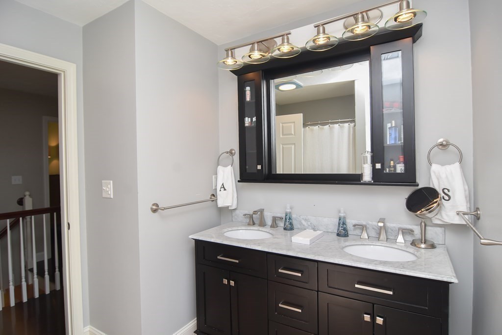 151 School Street Acton, MA 01720 - Photo 20 of 39 a bathroom with a sink vanity and a mirror