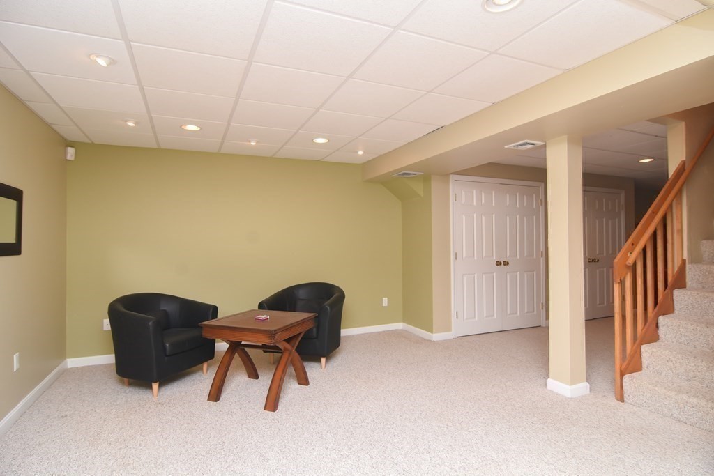 151 School Street Acton, MA 01720 - Photo 25 of 39 a view of workspace with furniture and a ceiling fan