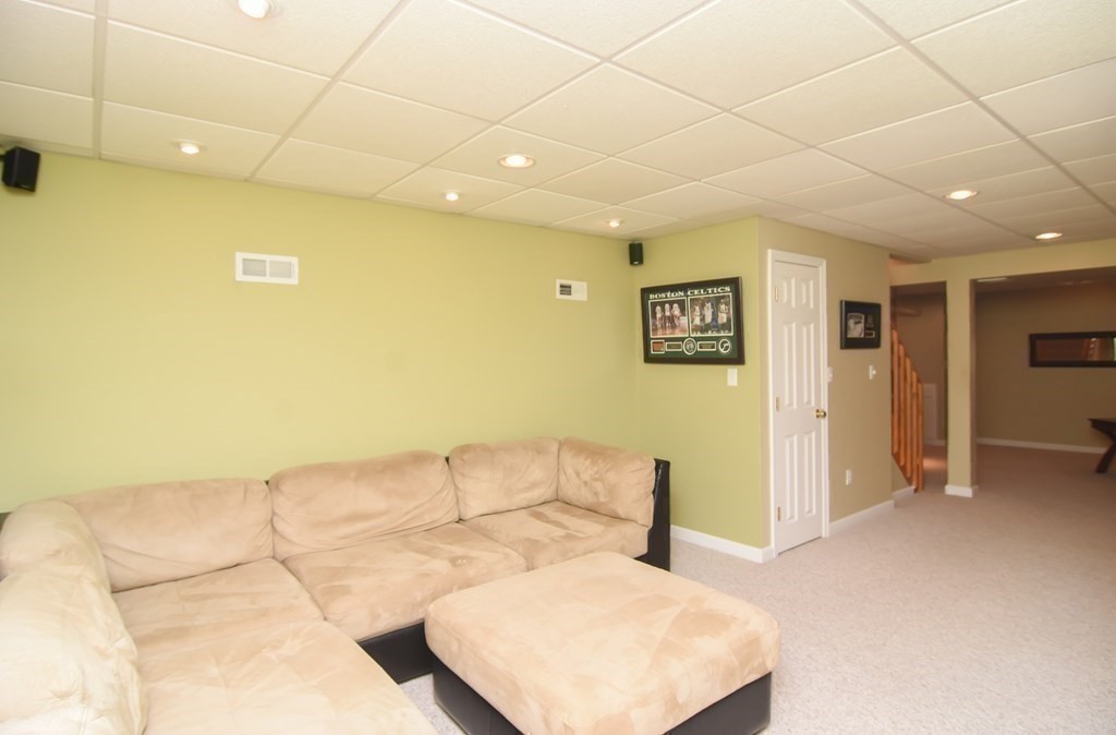 151 School Street Acton, MA 01720 - Photo 26 of 39 a bedroom with a bed and a couch