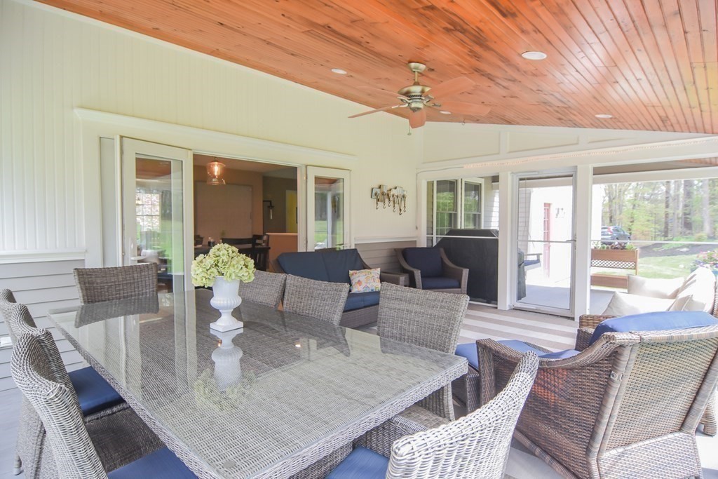 151 School Street Acton, MA 01720 - Photo 31 of 39 a view of a dining room with furniture a chandelier and wooden floor