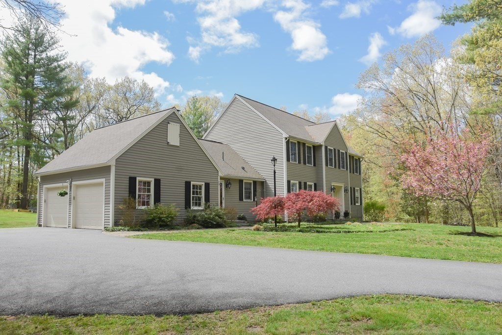 151 School Street Acton, MA 01720 - Photo 36 of 39 a front view of house with yard and green space