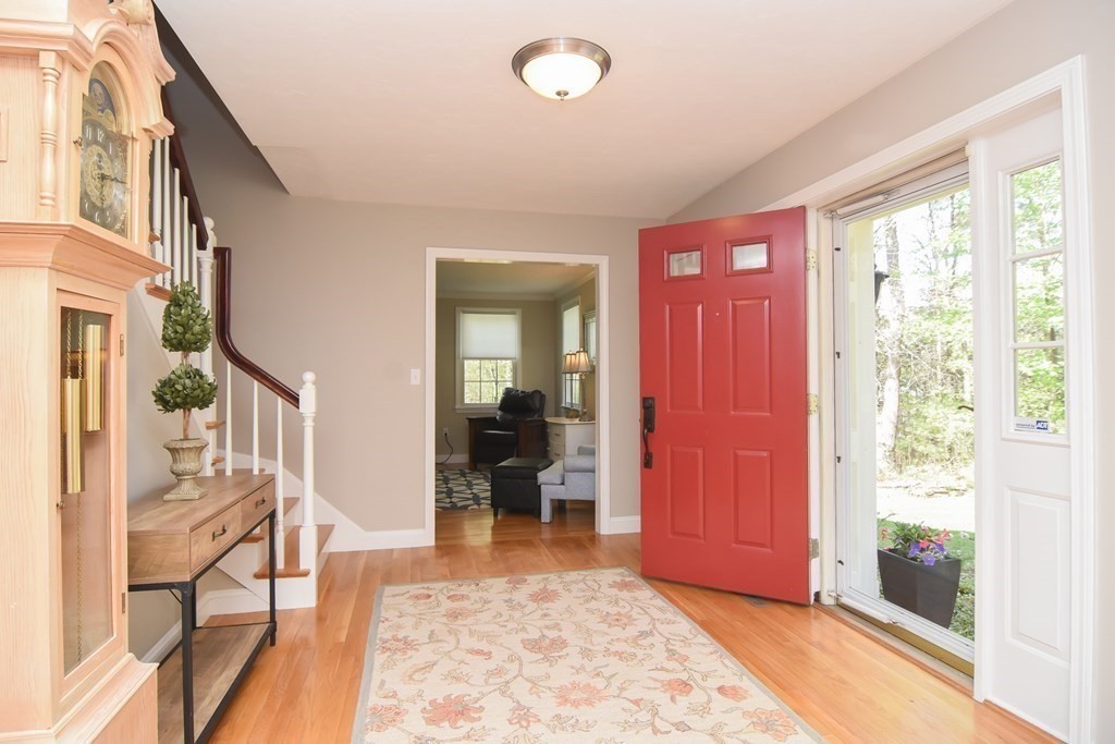151 School Street Acton, MA 01720 - Photo 4 of 39 an entryway and livingroom with furniture