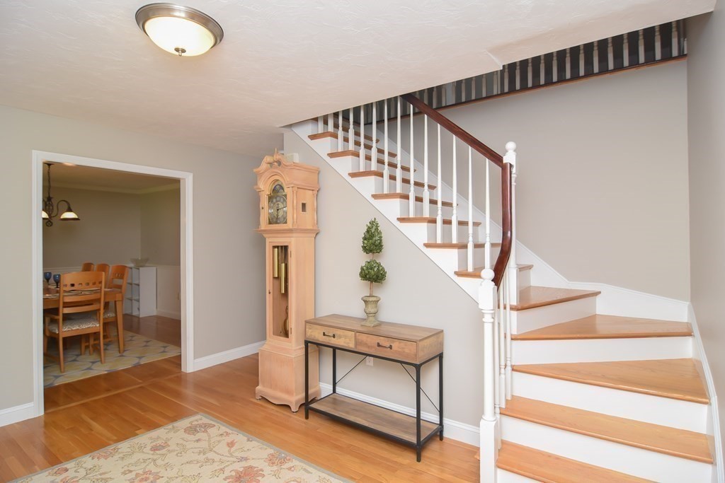 151 School Street Acton, MA 01720 - Photo 5 of 39 a view of entryway and hall with wooden floor