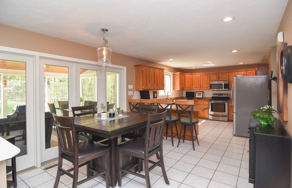 151 School Street Acton, MA 01720 - Photo 7 of 39 a view of a dining room with furniture window and outside view