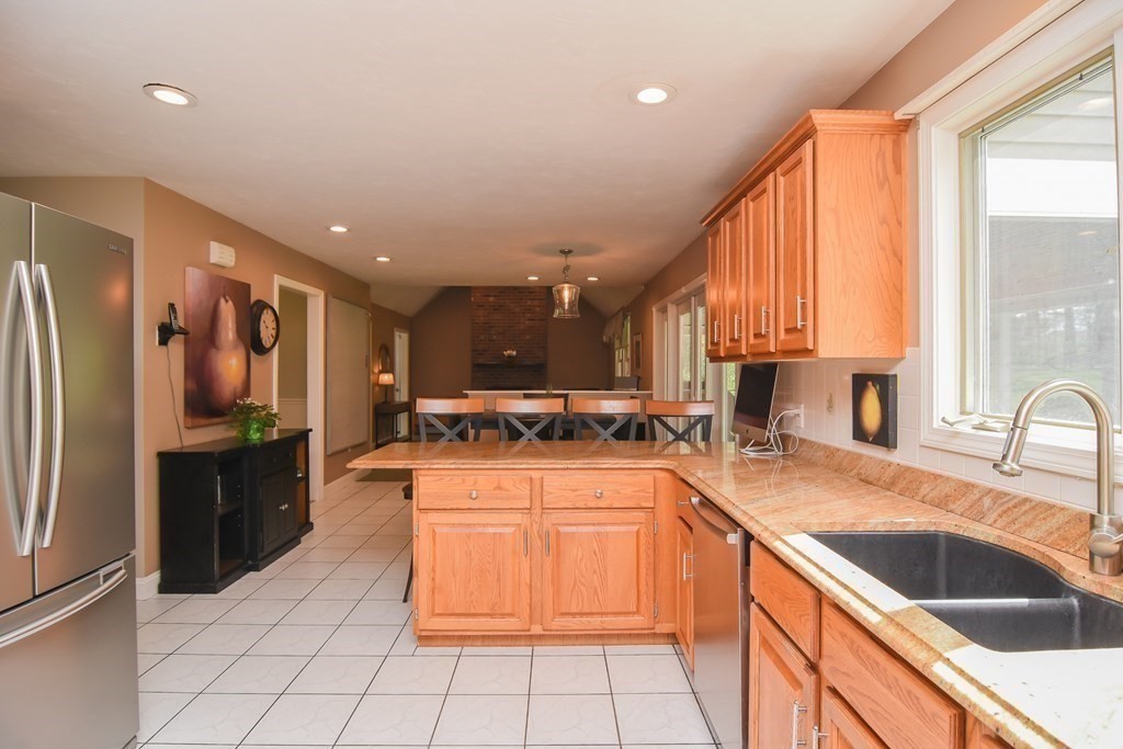 151 School Street Acton, MA 01720 - Photo 8 of 39 a kitchen with a sink appliances and cabinets