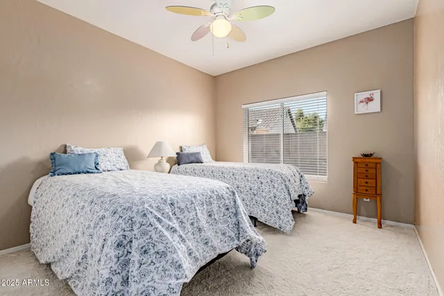 a bedroom with bed and a window