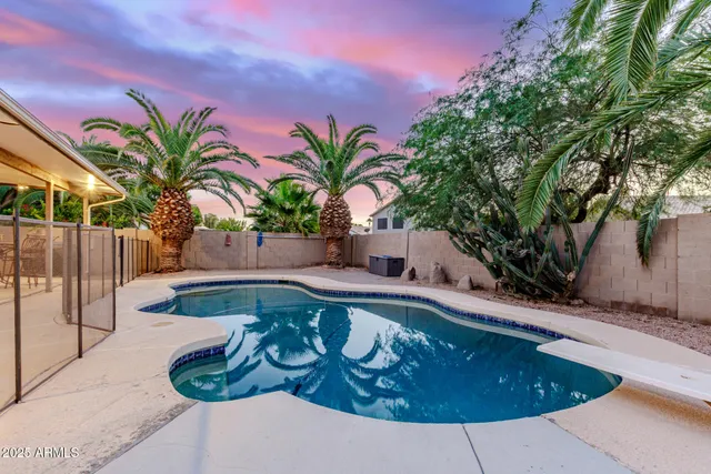 a view of a swimming pool with a patio