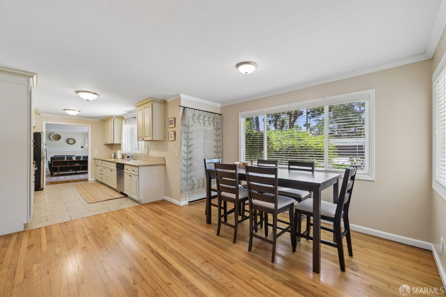 4052 Costado Road Pebble Beach, CA 93953 - Photo 11 of 35 a view of a dining room with furniture and wooden floor