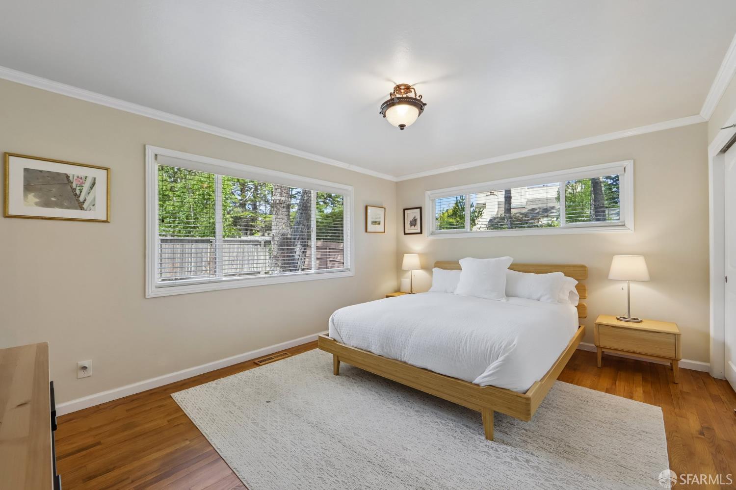 4052 Costado Road Pebble Beach, CA 93953 - Photo 18 of 35 a bedroom with a bed and a table
