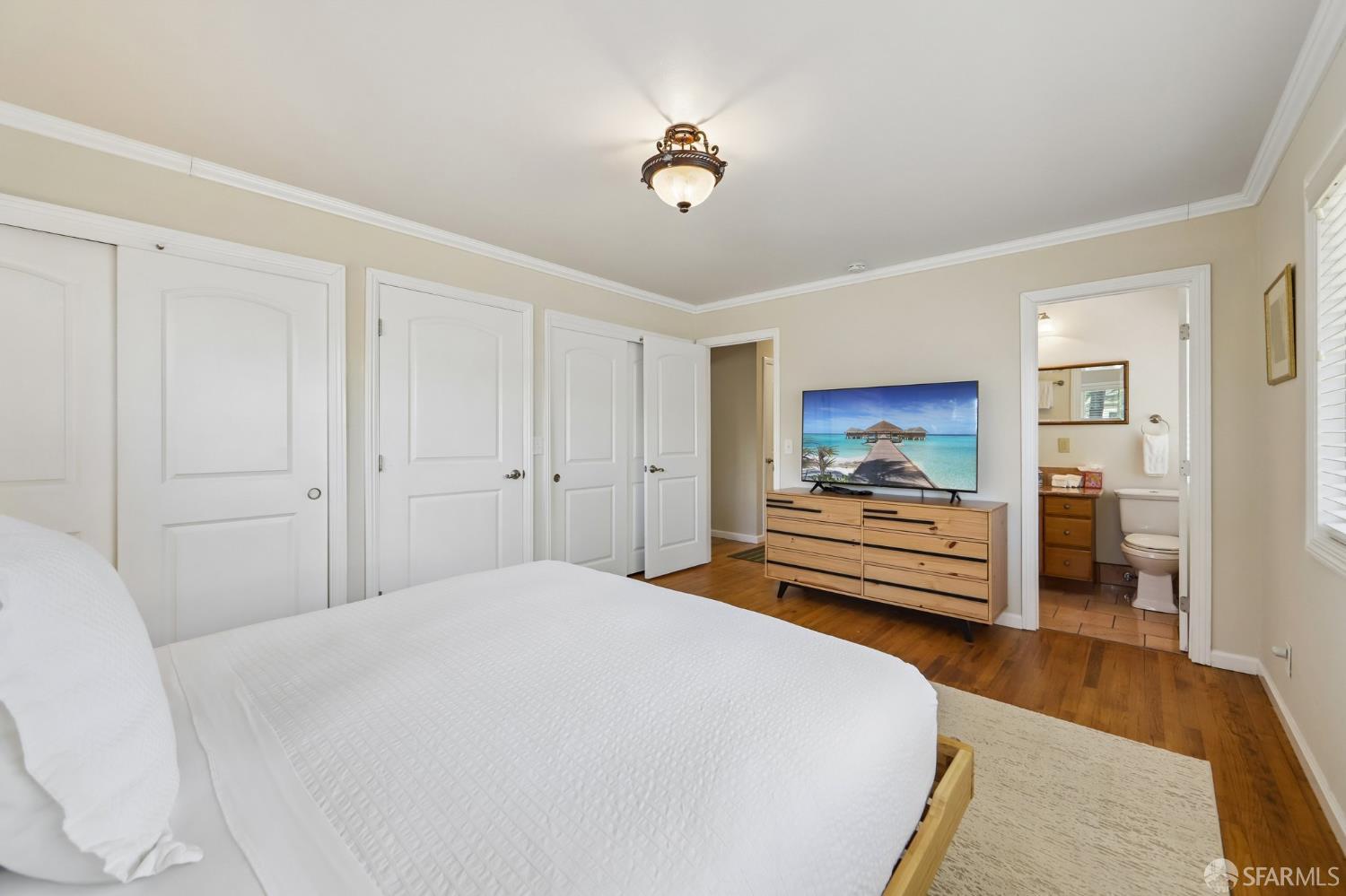4052 Costado Road Pebble Beach, CA 93953 - Photo 19 of 35 a bedroom with a bed and a view mirror