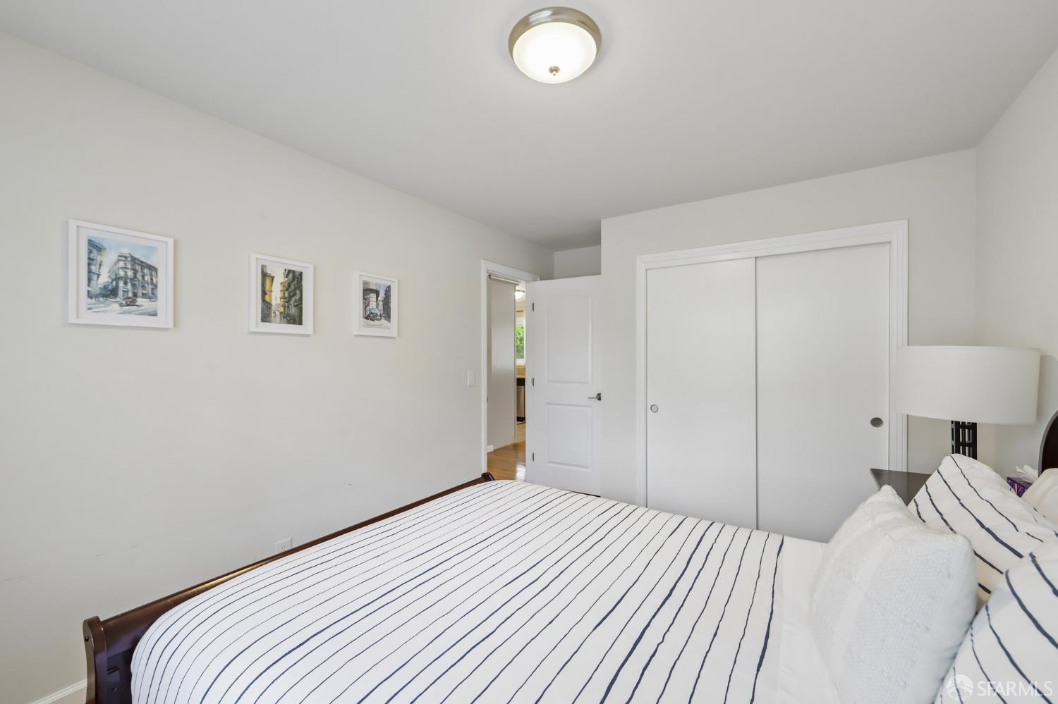 4052 Costado Road Pebble Beach, CA 93953 - Photo 26 of 35 a bedroom with a bed and a lamp