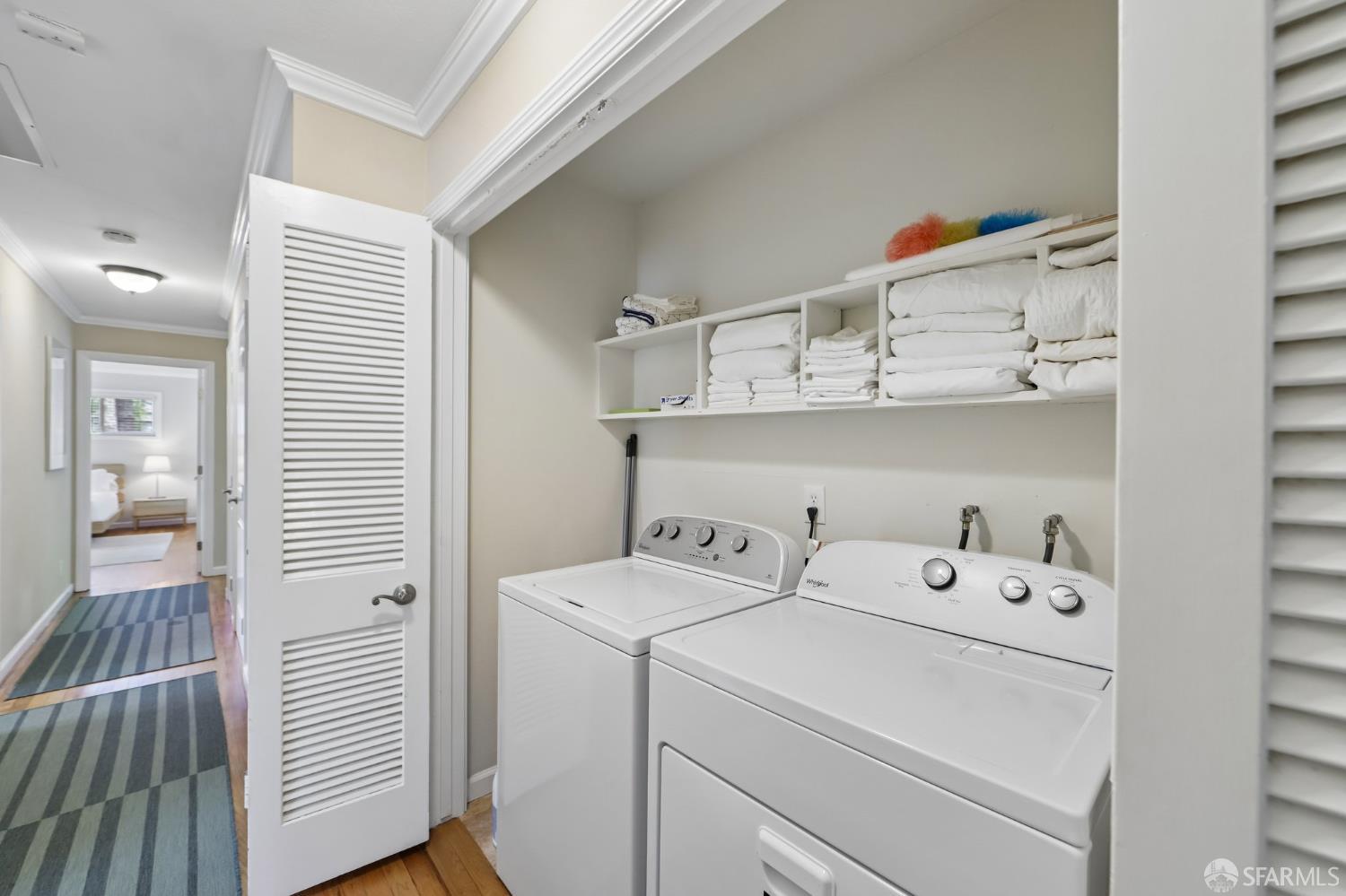 4052 Costado Road Pebble Beach, CA 93953 - Photo 27 of 35 a view of washer and dryer with bathroom in the background