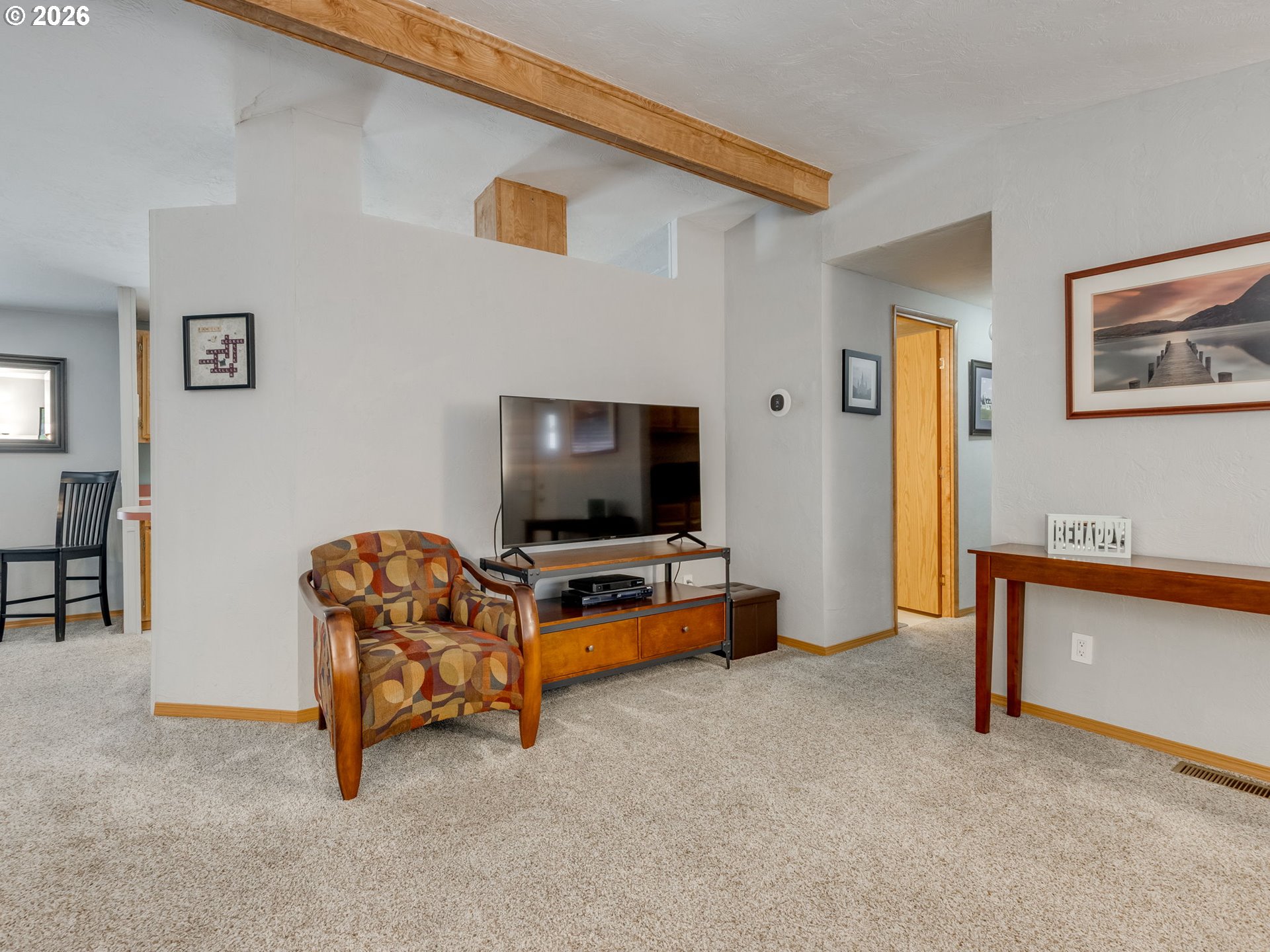 4730 Auburn Road Northeast, Unit 125 Salem, OR 97301 - Photo 4 of 36 a living room with furniture and a flat screen tv