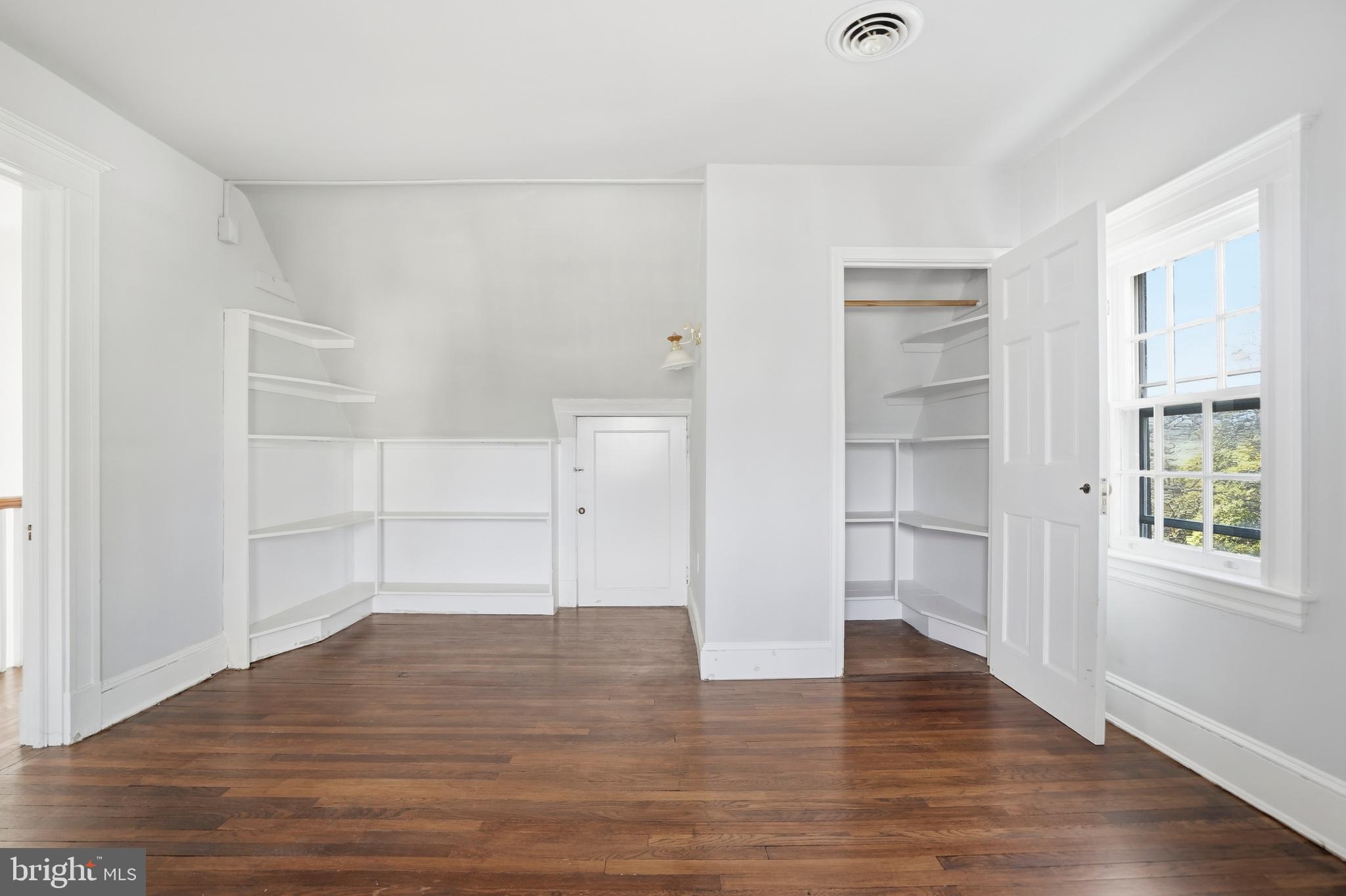 4416 Underwood Road Baltimore, MD 21218 - Photo 32 of 42 a view of empty room with wooden floor