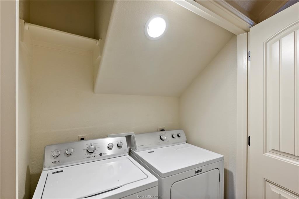 4295 Commando Trail College Station, TX 77845 - Photo 14 of 25 a view of washer and dryer with bathroom in the background