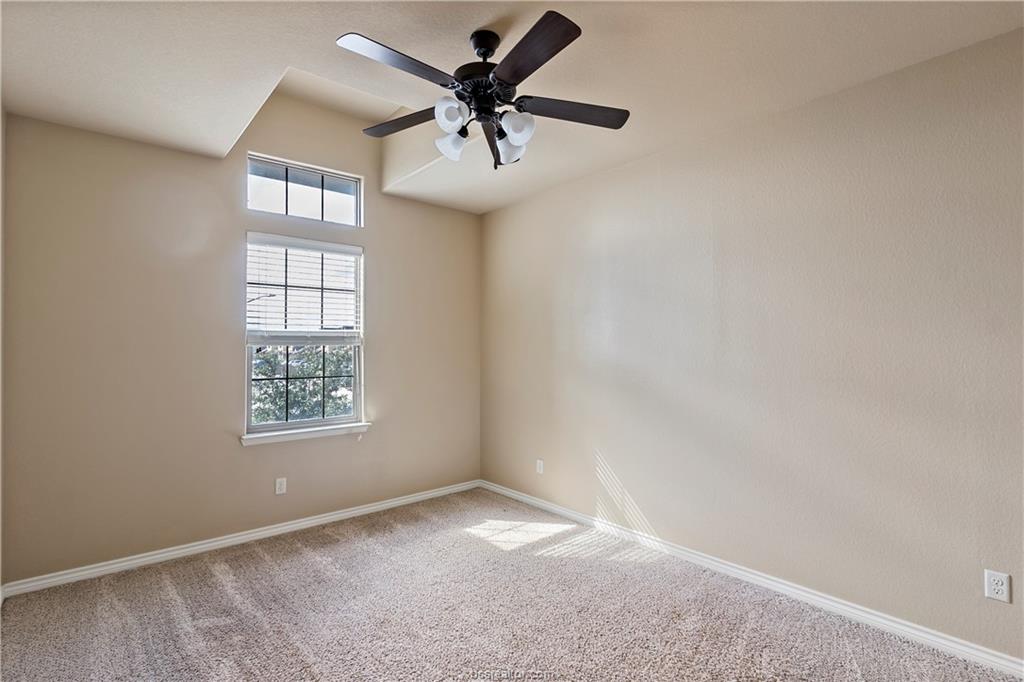 4295 Commando Trail College Station, TX 77845 - Photo 20 of 25 an empty room with windows and fan