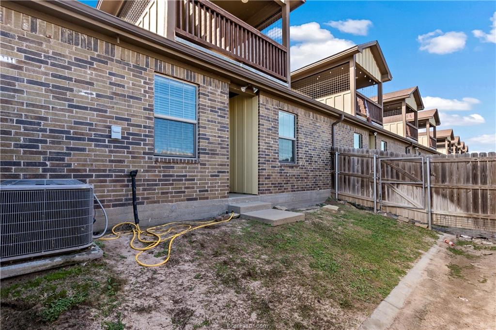 4295 Commando Trail College Station, TX 77845 - Photo 25 of 25 a backyard of a house with a large tree