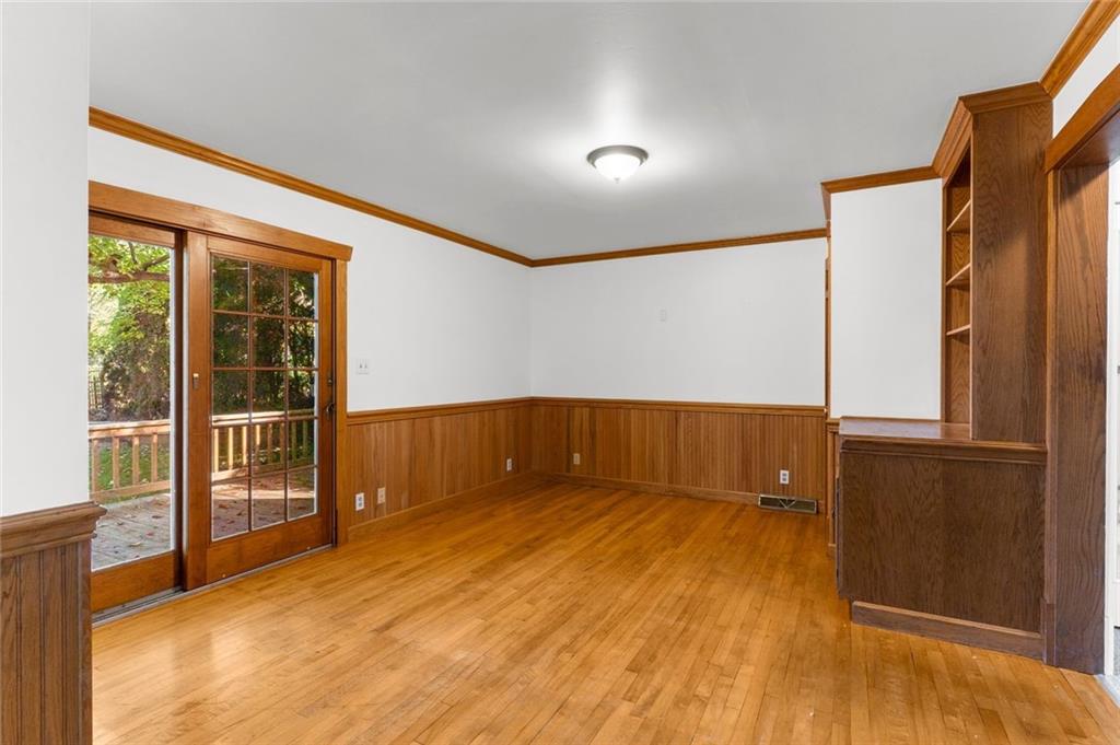 841 Highland Road Sharon, PA 16146 - Photo 11 of 39 an empty room with wooden floor and windows