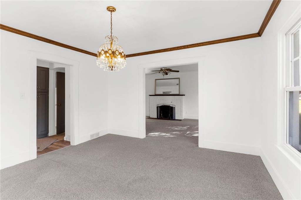 841 Highland Road Sharon, PA 16146 - Photo 13 of 39 a view of a kitchen with a sink and a chandelier