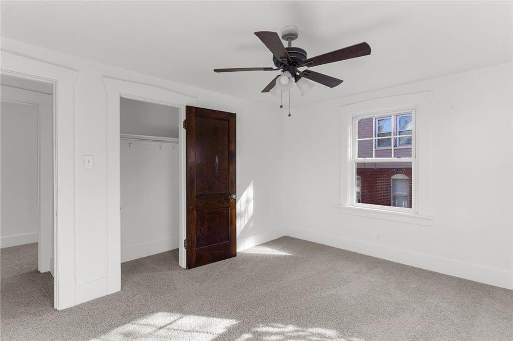 841 Highland Road Sharon, PA 16146 - Photo 21 of 39 a view of a livingroom with a ceiling fan and window