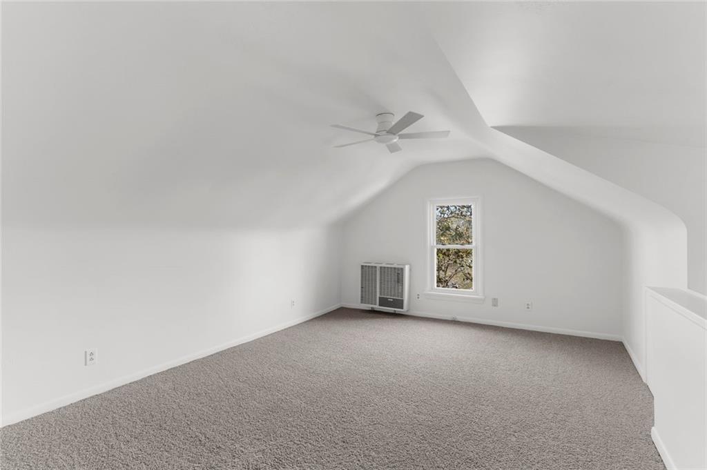 841 Highland Road Sharon, PA 16146 - Photo 25 of 39 an empty room with a window and a ceiling fan