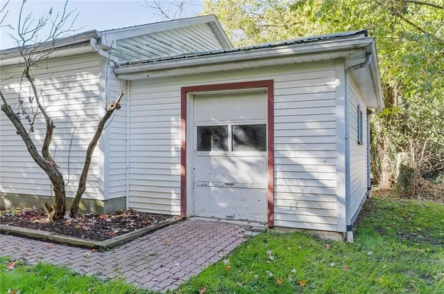 a view of a backyard with large trees