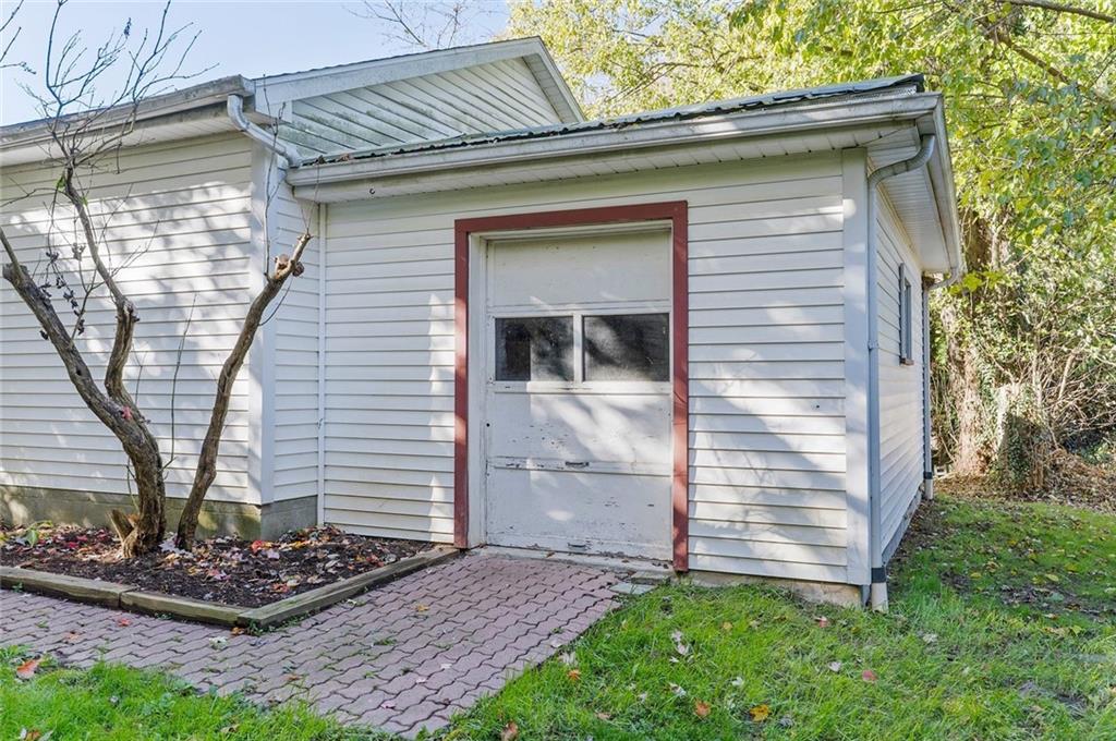 841 Highland Road Sharon, PA 16146 - Photo 32 of 39 a front view of a house with garden