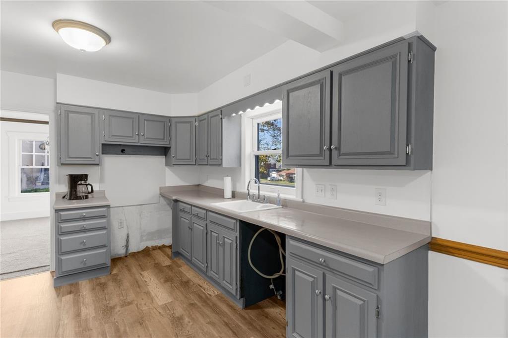 841 Highland Road Sharon, PA 16146 - Photo 8 of 39 a kitchen with sink cabinets and wooden floor