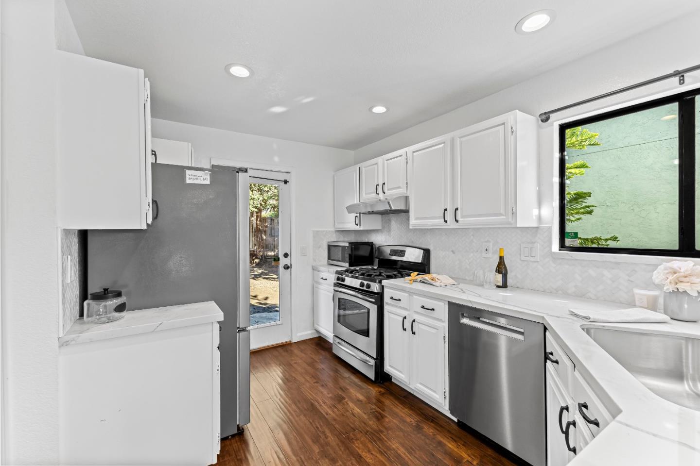 1165 Lerma Lane Gilroy, CA 95020 - Photo 10 of 37 a kitchen with a sink stove and refrigerator