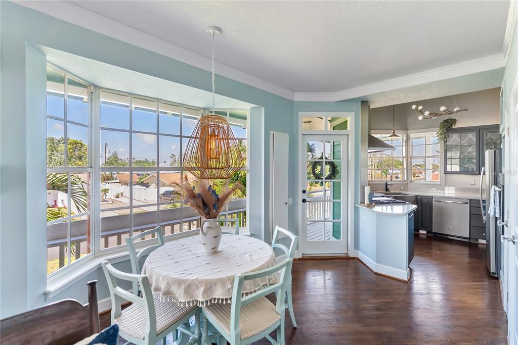 861 Nectar Road Venice, FL 34293 - Photo 12 of 75 a view of a dining room with furniture and wooden floor