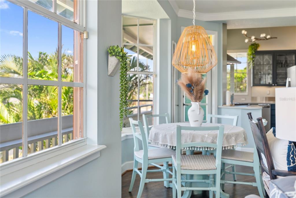 861 Nectar Road Venice, FL 34293 - Photo 13 of 75 a view of a dining room with furniture a potted plant and a floor to ceiling window
