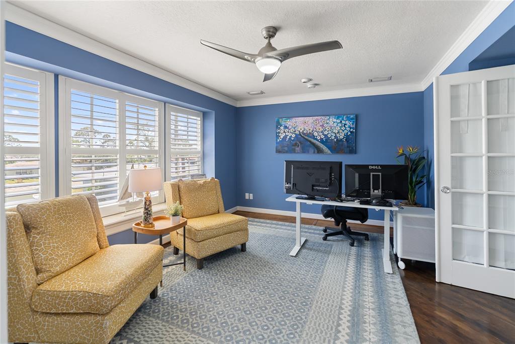 861 Nectar Road Venice, FL 34293 - Photo 22 of 75 a living room with furniture a flat screen tv and a large window