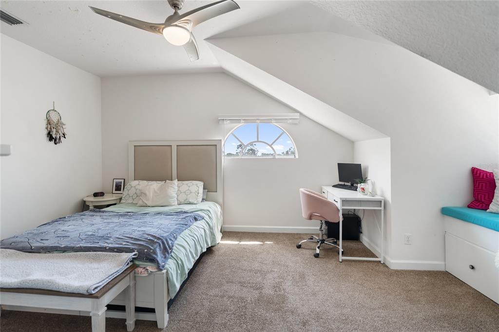 861 Nectar Road Venice, FL 34293 - Photo 29 of 75 a bedroom with a bed and a desk