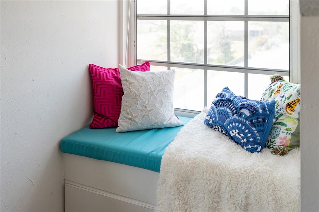 861 Nectar Road Venice, FL 34293 - Photo 30 of 75 a bed sitting in a bedroom next to a window