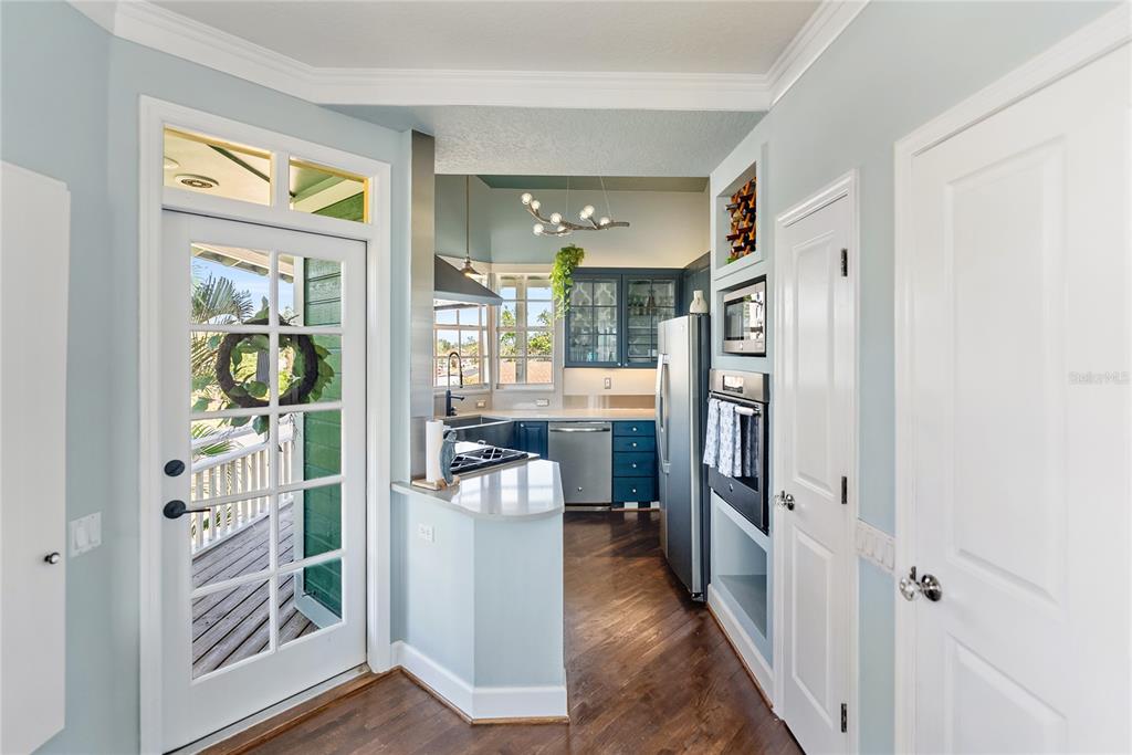 861 Nectar Road Venice, FL 34293 - Photo 4 of 75 a view of a hallway with wooden floor and a living room